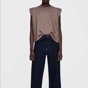 Shoulder Padded t shirt in size S